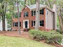 Charming brick two-story home with black shutters and a well-manicured lawn at 2863 Landing Dr, Marietta, GA 30066
