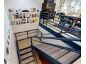 Multi-level staircase with custom shelving and modern design, adding architectural interest to the home at 587 Virginia Ne Ave # 314, Atlanta, GA 30306