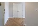 Entryway featuring wood-look flooring in a herringbone pattern and clean, neutral walls at 2161 Peachtree Ne Rd # 907, Atlanta, GA 30309