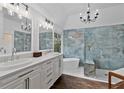 Luxurious bathroom with double vanities, a soaking tub, and a glass-enclosed shower at 5485 Woodrun Ln, Johns Creek, GA 30005