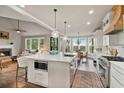 Bright, open kitchen with a large island, modern appliances, and a breakfast nook at 5485 Woodrun Ln, Johns Creek, GA 30005
