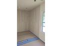 An in-progress bathroom space features a modern design with tiled walls and prepared flooring for a clean, contemporary look at 996 Camilla St, Atlanta, GA 30314