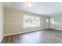 Bright living room with fresh paint, modern trim, and beautiful hardwood floors at 1973 Columbia Dr, Decatur, GA 30032