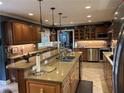 Gourmet kitchen featuring custom cabinetry, granite countertops, and stainless steel appliances at 2112 Fisher Ne Trl, Atlanta, GA 30345