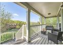 Inviting porch area with comfortable seating and beautiful outdoor views at 24 Laurel Ne Way, White, GA 30184