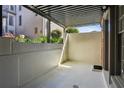 Private outdoor patio with a covered pergola, offering a tranquil space for relaxation at 3091 Colonial Way # F2, Atlanta, GA 30341
