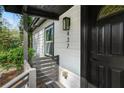 Close up of front door with modern lighting and house number displayed at 437 Collier Ridge Nw Dr, Atlanta, GA 30318