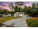 Landscaped property featuring a long driveway to the freshly remodeled home at 5469 Helen Pl Sw, Mableton, GA 30126