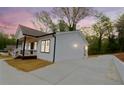 Beautiful home with a well-maintained lawn and a freshly paved driveway at 5469 Helen Pl Sw, Mableton, GA 30126