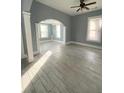 Living room featuring hardwood floors, gray walls, and an open floorplan at 693 Dill Sw Ave, Atlanta, GA 30310