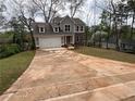 Beautifully designed home with a long driveway and fresh landscaping in a serene setting at 71 Dillard Ne Dr, Kennesaw, GA 30144