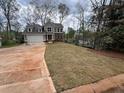 Well-maintained property with a spacious lawn and modern design elements at 71 Dillard Ne Dr, Kennesaw, GA 30144