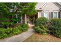 Charming front porch featuring stone accents and a welcoming entrance at 5628 Harbormist Dr, Powder Springs, GA 30127