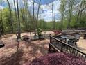 Landscaped backyard deck area, perfect for outdoor entertaining at 7020 Grassmoor Grange Way, Cumming, GA 30040