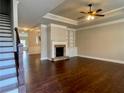 Spacious living room with fireplace, built-ins, and hardwood floors at 725 Valley Glen Dr, Dacula, GA 30019