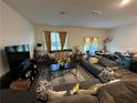 Spacious living room with ample seating and natural light at 136 Swindon Dr, Mcdonough, GA 30253