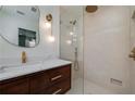 Modern bathroom features a walk-in shower, sleek vanity, and stylish gold fixtures at 2569 Woodhill Ln, Atlanta, GA 30344