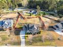 Aerial view of a two-story home on a spacious lot with mature trees and a long driveway at 4535 Meadow Green Ln, Acworth, GA 30101