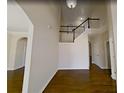 Inviting foyer showcases hardwood floors, a staircase with white railings, and neutral paint at 6793 Oconee Pl, Fairburn, GA 30213