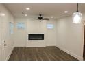 Bright living room with dark wood floors, a modern fireplace, and recessed lighting at 2022 Detroit Ave, Atlanta, GA 30314