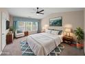 Serene main bedroom with large windows, plush bedding, and elegant decor for a peaceful retreat at 5510 Weddington Dr, Cumming, GA 30040