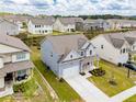 Aerial view showcasing the property's location within a well-planned community with neatly arranged homes at 2396 Bear Mountain St, Lithonia, GA 30058