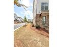 Well-kept three-story townhouse in a quiet neighborhood with a green lawn at 1166 Farmstead Rd, Suwanee, GA 30024