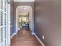 Elegant foyer with hardwood floors leading into a bright, open living space at 2436 Sardis Chase Ct, Buford, GA 30519