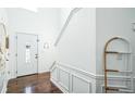 Clean entryway with hardwood floors, stairway to second floor, and simple decor at 1240 Birchwood Ln, Roswell, GA 30076