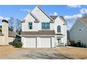 Charming two-story home with a two-car garage, well-manicured lawn, and traditional architectural details at 1240 Birchwood Ln, Roswell, GA 30076