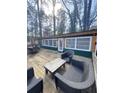 Inviting back deck with outdoor seating area, ideal for enjoying the outdoors and relaxing in nature at 5440 Portside Dr, Acworth, GA 30101