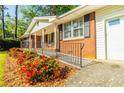 Traditional brick home featuring red azaleas and well-maintained landscaping at 2972 Ponderosa Cir, Decatur, GA 30033