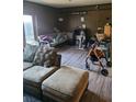 Comfortable living room with wood-look flooring and access to the outdoors at 3346 Northcrest Rd # A, Atlanta, GA 30340