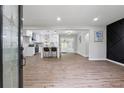 Spacious living room with wood floors and an open view of the modern kitchen at 1232 Andrews Dr, Marietta, GA 30062