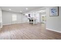 Bright living area with wood floors leading to a modern, eat-in kitchen at 1232 Andrews Dr, Marietta, GA 30062