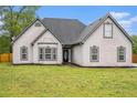 Charming single-story home with a well-maintained lawn and inviting curb appeal at 609 Alyssa Ct, Locust Grove, GA 30248