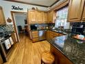 Traditional kitchen with stainless appliances, and hardwood floors and breakfast nook at 2514 Green Forest Ct, Snellville, GA 30078