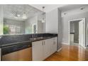 Kitchen showcasing the stainless steel dishwasher and black granite counters at 250 Pharr Ne Rd, Atlanta, GA 30305