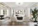 Bright living room with hardwood floors, white furniture, modern decor and large windows at 400 Stone Lea Trce, Oxford, GA 30054