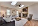 Cozy living room featuring a stone fireplace, hardwood floors, and plenty of natural light from two windows at 175 W Station Nw Dr, Kennesaw, GA 30144
