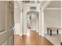 Open foyer featuring hardwood floors, a view of the upper level, and an arched doorway at 2369 Apalachee Crucis Ln, Dacula, GA 30019