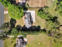 Aerial view of the home showing the roof, driveway, and the surrounding green landscape at 3175 Old Jonesboro Rd, Fairburn, GA 30213