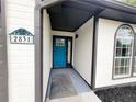 Close-up of a charming blue front door with decorative house numbers at 2831 Skye Ter, Duluth, GA 30096