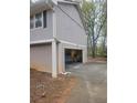 Attached garage with an open door, showing ample space for parking and storage at 5251 Greenpoint Dr, Stone Mountain, GA 30088