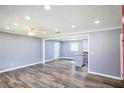 Spacious living room showcasing luxury vinyl plank flooring and a view of the eat-in kitchen at 5251 Joan Of Arc Pl, Atlanta, GA 30349