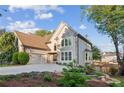 Charming two-story home with stone accents, lush landscaping, and a welcoming curb appeal at 422 Laurian Nw Way, Kennesaw, GA 30144