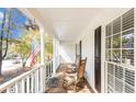 Inviting covered front porch with rocking chairs, perfect for relaxing and enjoying the outdoors at 30 Dogwood Trl, Dallas, GA 30157