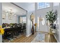 Open foyer with views into the dining room, showcasing the home's natural light and modern design at 543 Walnut Way, Palmetto, GA 30268