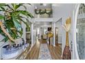Inviting foyer featuring hardwood floors, a staircase, and elegant decor at 543 Walnut Way, Palmetto, GA 30268