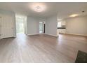 Bright living room featuring stylish flooring, recessed lighting, and seamless flow to other areas at 3058 Arden Ridge Ter, Suwanee, GA 30024